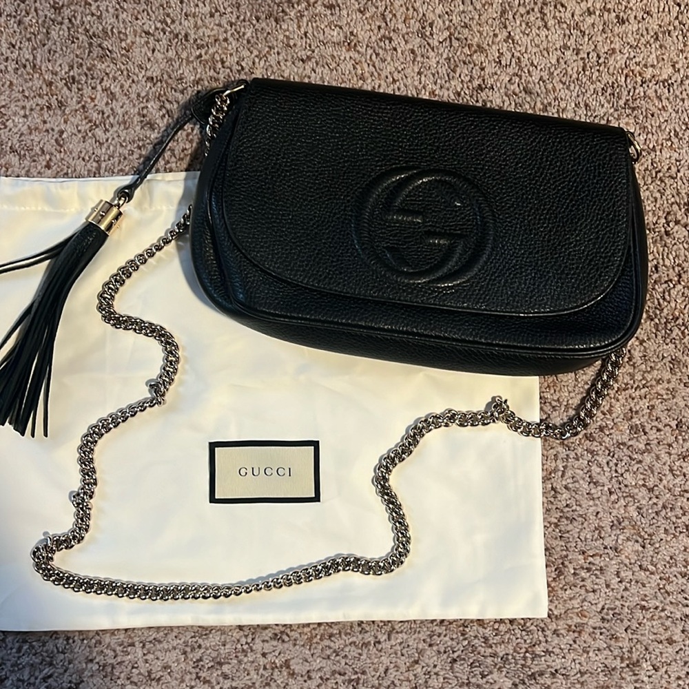 Gucci crossbody bag. Black with silvered chain. Only used a handful of times.